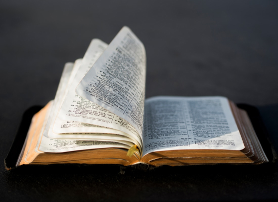 The pages of a Bible turning